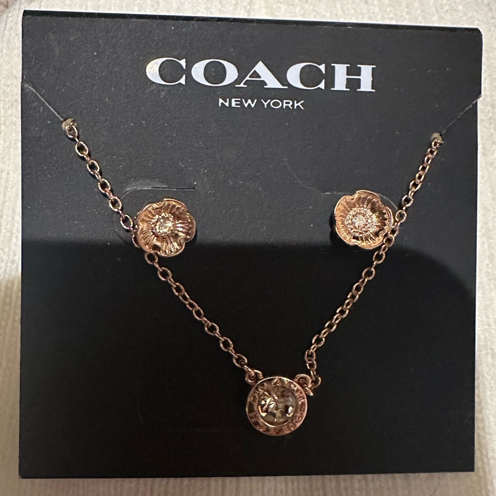 Coach jewelry. Rose gold never worn.